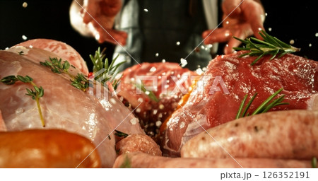 Fresh butcher cut meat assortment. Raw Various Kinds of Meat Served on a Table. Preparation of Meat. Isolated on Black Background. 126352191