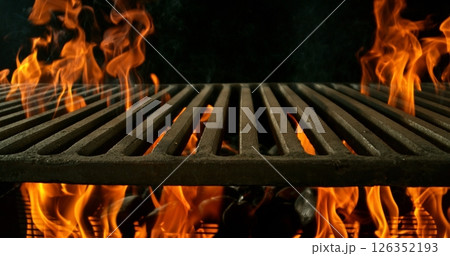 Hot empty portable barbecue BBQ grill with flaming fire and ember charcoal on black background. Waiting for the placement of your food. Hot empty portable barbecue BBQ grill with flaming fire and ember charcoal on black background. Waiting for the placement of your food. 126352193