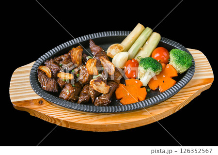Japanese garlic beef stir fry with vegetables on sizzling hot plate Japanese garlic beef stir fry with vegetables on sizzling hot plate 126352567