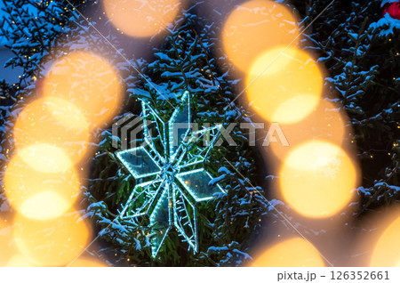 Christmas tree with yellow garlands lights and bokeh copy space 126352661