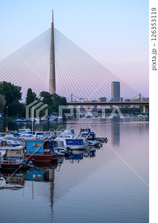Boat marina at Ada Ciganlija with Ada Bridge, a cable-stayed bridge over the Sava river in Belgrade, Serbia Boat marina at Ada Ciganlija with Ada Bridge, a cable-stayed bridge over the Sava river in Belgrade, Serbia 126353119