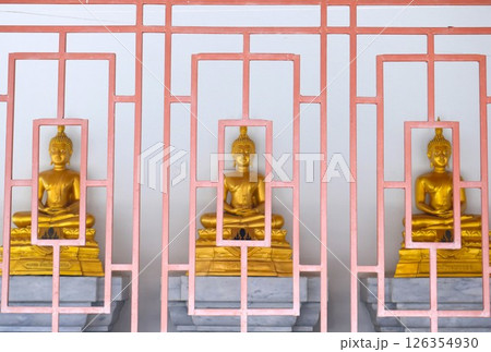 Golden Buddha statue with orange fence Golden Buddha statue with orange fence 126354930