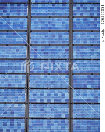 A blue building with solar panels on the roof A blue building with solar panels on the roof 126355051