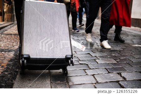 Big Travel Suitcase On A Cobblestone Street 126355226