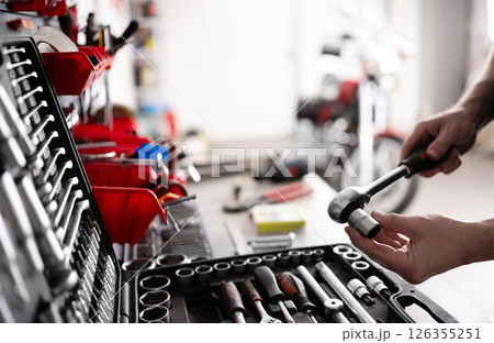 Auto Mechanic With Ratchet Wrench With Socket Tool Auto Mechanic With Ratchet Wrench With Socket Tool 126355251