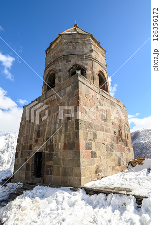 Gergeti Trinity Church near the village of Stepantsminda, popular tourist destination in the Caucasus in Georgia 126356172
