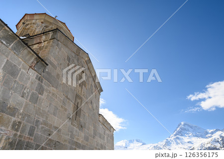 Gergeti Trinity Church and Mount Kazbek near the village of Stepantsminda in the Caucasus mountains in Georgia 126356175