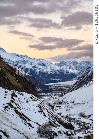 Terek river valley and mountain pass on the Georgian Military Road, major route through the Caucasus from Georgia to Russia 126356181