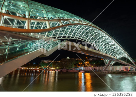Peace bridge, steel and glass construction pedestrian bridge over Kura Mtkvari river in central Tbilisi, capital of Georgia Peace bridge, steel and glass construction pedestrian bridge over Kura Mtkvari river in central Tbilisi, capital of Georgia 126356258