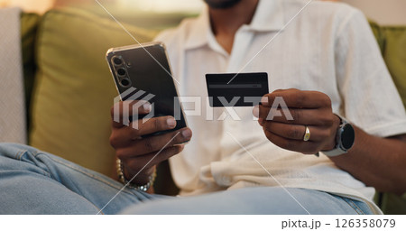Home, credit card and man with smartphone, hands and financial payment with savings, internet and investment. Ecommerce, online shopping and person with closeup, cellphone and digital app for banking Home, credit card and man with smartphone, hands and financial payment with savings, internet and investment. Ecommerce, online shopping and person with closeup, cellphone and digital app for banking 126358079