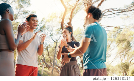 Runner, laughing and applause with friends in nature for fitness, workout partners and health. Wellness, exercise club and support with people outdoor for success, training and challenge together Runner, laughing and applause with friends in nature for fitness, workout partners and health. Wellness, exercise club and support with people outdoor for success, training and challenge together 126358114