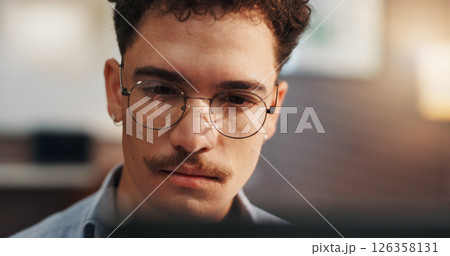 Glasses, computer and man in home for remote work, startup business and freelance career for planning. Professional, house and person on laptop for reading website, project report and research 126358131
