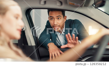 People, customer and salesman with discussion for car showroom, transport model and rental service. Dealership, woman and male seller with pitch for vehicle features, test drive and talking by flare 126358212