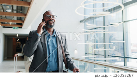 Businessman, walking or phone call with suitcase for travel, job opportunity or career trip at airport. Man, employee or traveler talking with mobile smartphone or luggage for commute or flight Businessman, walking or phone call with suitcase for travel, job opportunity or career trip at airport. Man, employee or traveler talking with mobile smartphone or luggage for commute or flight 126358267