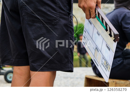 film production crew holding Film Slate on set film production crew holding Film Slate on set 126358270