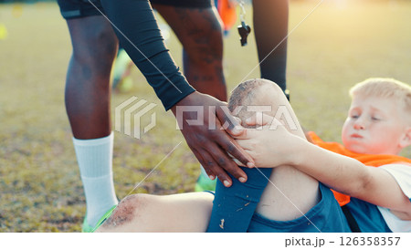 Soccer, child and knee pain for injury, accident and muscle tension during kick in sports competition. Football field, hands and coach with boy for helping, support and tendinitis emergency for kid Soccer, child and knee pain for injury, accident and muscle tension during kick in sports competition. Football field, hands and coach with boy for helping, support and tendinitis emergency for kid 126358357