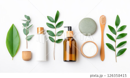 Natural skincare products arranged aesthetically with green leaves, including bottles, jars, and a toothbrush, showcasing eco-friendly beauty essentials and promoting a sustainable lifestyle Natural skincare products arranged aesthetically with green leaves, including bottles, jars, and a toothbrush, showcasing eco-friendly beauty essentials and promoting a sustainable lifestyle 126358415