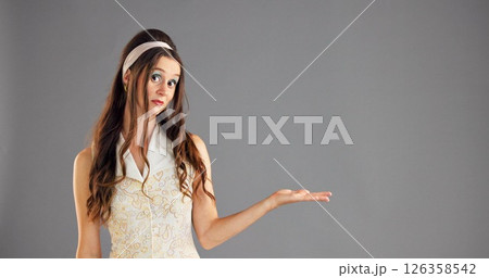 Portrait, open hand and woman in studio, option and questions on gray background. Face, person and model with gesture, choice and shrug with decision, comparison and offer with selection and space Portrait, open hand and woman in studio, option and questions on gray background. Face, person and model with gesture, choice and shrug with decision, comparison and offer with selection and space 126358542