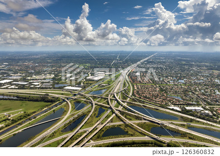 USA car urban transportation infrastructure. American highway junction with fast driving vehicles in Miami, Florida USA car urban transportation infrastructure. American highway junction with fast driving vehicles in Miami, Florida 126360832