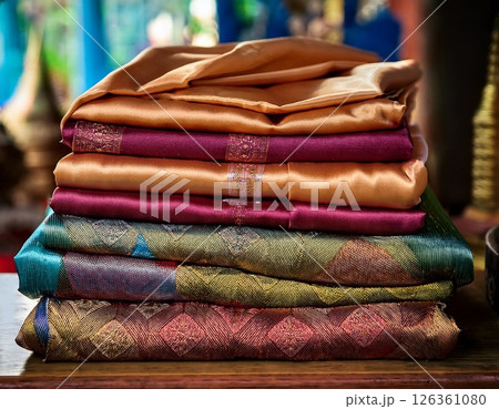 A stack of neatly folded traditional Thai silk A stack of neatly folded traditional Thai silk 126361080