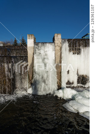 Frozen waterfall water. A frozen waterfall on a February morning Frozen waterfall water. A frozen waterfall on a February morning 126361107