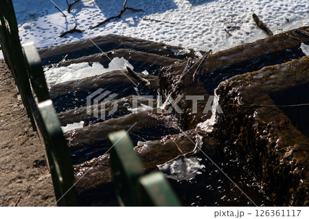 Frozen, old, Soviet waterfall, on a February morning. Looking down Frozen, old, Soviet waterfall, on a February morning. Looking down 126361117