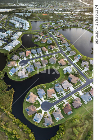 Residential neighborhood in Florida with suburban houses. Development of US premium housing Residential neighborhood in Florida with suburban houses. Development of US premium housing 126361274