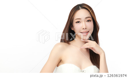 A beautiful young Asian woman with clean, fresh skin against a white background. Skincare, facial treatment, cosmetology, beauty, and spa. An elegant portrait of an Asian woman. 126361974