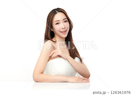 A beautiful young Asian woman with clean, fresh skin against a white background. Skincare, facial treatment, cosmetology, beauty, and spa. An elegant portrait of an Asian woman. 126361976