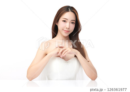 A beautiful young Asian woman with clean, fresh skin against a white background. Skincare, facial treatment, cosmetology, beauty, and spa. An elegant portrait of an Asian woman. 126361977