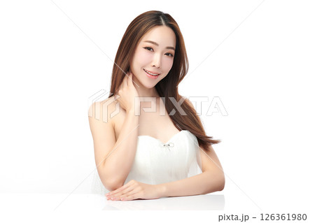 A beautiful young Asian woman with clean, fresh skin against a white background. Skincare, facial treatment, cosmetology, beauty, and spa. An elegant portrait of an Asian woman. A beautiful young Asian woman with clean, fresh skin against a white background. Skincare, facial treatment, cosmetology, beauty, and spa. An elegant portrait of an Asian woman. 126361980