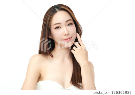 A beautiful young Asian woman with clean, fresh skin against a white background. Skincare, facial treatment, cosmetology, beauty, and spa. An elegant portrait of an Asian woman. A beautiful young Asian woman with clean, fresh skin against a white background. Skincare, facial treatment, cosmetology, beauty, and spa. An elegant portrait of an Asian woman. 126361985
