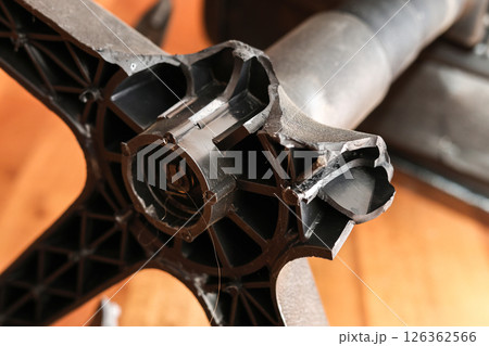 Man holding broken leg of office chair: workplace trouble, defective chair 126362566