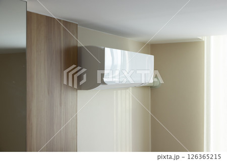 Air conditioner in room for cool climate. 126365215