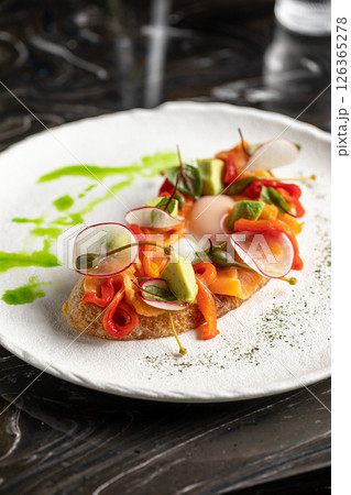 Gourmet bruschetta with salmon and vegetables 126365278