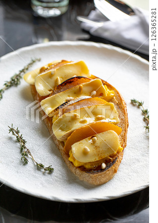 Toast with scrambled egg pear and brie 126365281