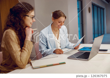 Engaging in Collaborative Teamwork within a Contemporary Office Environment Space 126367075