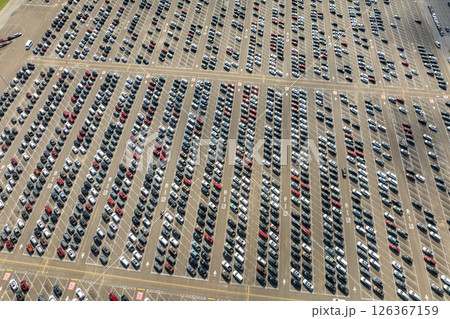 New cars parked on automotive factory parking lot for worldwide export. Dealer vehicle inventory business commercial 126367159