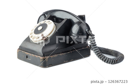 Vintage black phone isolated on a white background. Vintage black phone isolated on a white background. 126367223