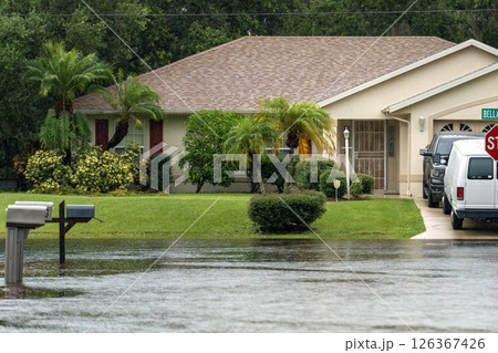 Hurricane flooded street with mail box surrounded with water in Florida residential area. Consequences of natural disaster 126367426