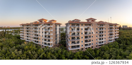 Condo building in Florida rural wooded area with view at tropical nature. Real estate development in American suburbs 126367934