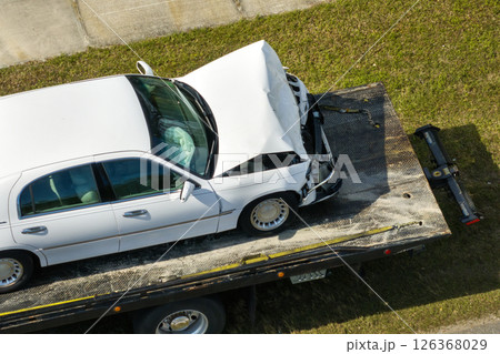 Car accident on city street in Florida. Emergency services and tow truck at vehicle crash in USA Car accident on city street in Florida. Emergency services and tow truck at vehicle crash in USA 126368029
