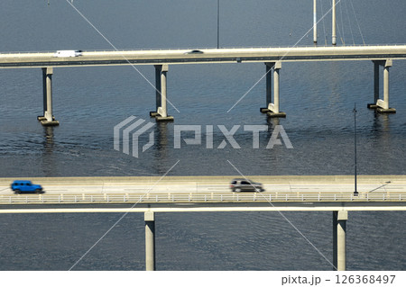 Barron Collier Bridge and Gilchrist Bridge in Florida with moving traffic. Transportation infrastructure in Charlotte County connecting Punta Gorda and Port Charlotte over Peace River Barron Collier Bridge and Gilchrist Bridge in Florida with moving traffic. Transportation infrastructure in Charlotte County connecting Punta Gorda and Port Charlotte over Peace River 126368497