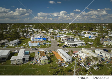 Badly damaged mobile homes after hurricane Ian in Florida residential area. Consequences of natural disaster Badly damaged mobile homes after hurricane Ian in Florida residential area. Consequences of natural disaster 126368498