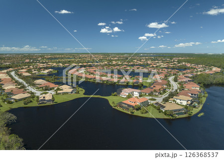 Aftermath of natural disaster. Surrounded by hurricane Ian rainfall flood waters homes in Florida residential area 126368537