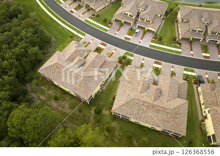 Aerial view of tightly packed homes in Florida closed living clubs. Family houses as example of real estate development in american suburbs Aerial view of tightly packed homes in Florida closed living clubs. Family houses as example of real estate development in american suburbs 126368556