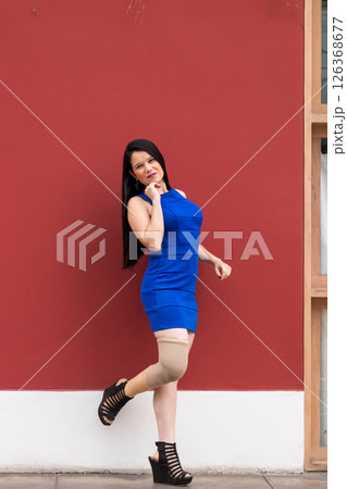 Woman with prosthetic leg is happy about her condition Woman with prosthetic leg is happy about her condition 126368677