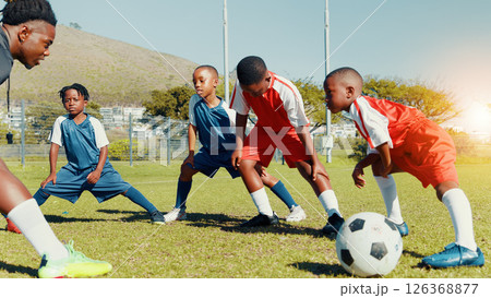 Coach, black kids and stretching for soccer practice of fitness training, exercise and sports workout. Children, warm up and preparation for game, learning skills and team challenge of match activity 126368877