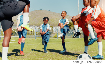 Group, children and stretching for soccer practice for fitness training, balance exercise and sports workout. Kids, warm up and prepare for game, learning skills and team challenge for match activity 126368883
