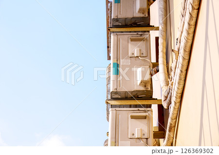 Stacked Air Conditioning Units on a Building Exterior in Daylight 126369302